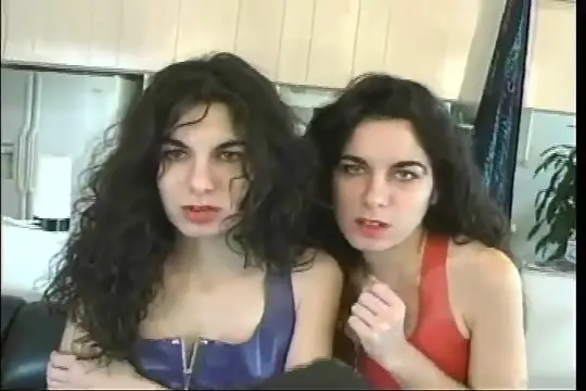 Poster: Wanna Be Doms. Two wanna be rockers with their guitars grace the screen, showing you they have what it takes to make you anxious to see more of them!